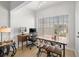 Well-lit home office with a large window, wooden desk, and neutral-toned decor at 800 S Dakota Ave # 337, Tampa, FL 33606