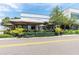The Meat Market features an outdoor patio with umbrella seating surrounded by manicured plants and greenery at 800 S Dakota Ave # 337, Tampa, FL 33606