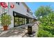 Upscale shopping area with awnings, a manicured landscape, and storefronts at 800 S Dakota Ave # 337, Tampa, FL 33606
