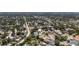 The aerial view displays the home's location in a tree-lined residential area at 8060 Canterbury Cir, Seminole, FL 33777