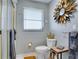Modern bathroom features a shower with glass doors, decorative mirror, and stylish towel racks at 8060 Canterbury Cir, Seminole, FL 33777