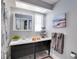 Bright bathroom featuring a vanity, lots of natural light and a three-tiered decorative item at 8060 Canterbury Cir, Seminole, FL 33777