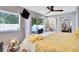 This spacious bedroom features a sliding door out to the patio and a ceiling fan at 8060 Canterbury Cir, Seminole, FL 33777