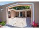 Charming home entrance featuring decorative landscaping and a bright, welcoming front door at 8060 Canterbury Cir, Seminole, FL 33777