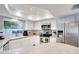 Bright kitchen with white cabinets, stainless steel appliances, and ample counter space at 8060 Canterbury Cir, Seminole, FL 33777