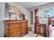 An ornate wooden dresser and nightstand decorated with lamps and decorative objects enhance the bedroom's appeal at 8060 Canterbury Cir, Seminole, FL 33777