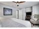 A bedroom with a ceiling fan, closet, dresser, and a comfortable chair provides a relaxing retreat at 8060 Canterbury Cir, Seminole, FL 33777