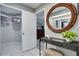 A well-organized walk-in closet featuring shelves and storage space, adjacent to a vanity table at 8060 Canterbury Cir, Seminole, FL 33777