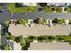 Straight down aerial view of roofs of homes and condos surrounded by green grass and paved roadways at 9314 Alta Sol Way, New Port Richey, FL 34655