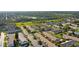 An aerial shot showcases the layout of this Florida community with tree-lined streets and green spaces at 9314 Alta Sol Way, New Port Richey, FL 34655