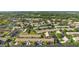 Gorgeous aerial view of a Florida community with lush landscaping and a serene pond at 9314 Alta Sol Way, New Port Richey, FL 34655