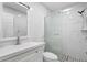 Updated bathroom featuring a new vanity, toilet and a glass enclosed shower with marble tile at 9314 Alta Sol Way, New Port Richey, FL 34655