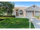 Charming single-story home featuring a well-manicured lawn and inviting curb appeal on a sunny day at 9314 Alta Sol Way, New Port Richey, FL 34655