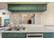 View from the kitchen showcases ample countertop space and view into the living room at 9314 Alta Sol Way, New Port Richey, FL 34655