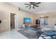 Spacious living room with tile flooring, a ceiling fan, and neutral paint to accommodate decor at 9314 Alta Sol Way, New Port Richey, FL 34655