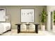Modern dining room design with a large art piece, dark table, and a stylish floor lamp at 9367 Cannon Beach Dr, Parrish, FL 34219
