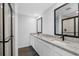 Elegant bathroom with double vanity, granite countertops, and a glass-enclosed shower at 9471 Eldridge Rd, Spring Hill, FL 34608