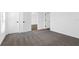 Cozy bedroom with neutral carpeting and convenient access to closet and hallway at 9471 Eldridge Rd, Spring Hill, FL 34608