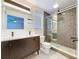 Modern bathroom featuring a double vanity, sleek shower with glass door, and contemporary finishes at 9580 130Th Ave, Largo, FL 33773