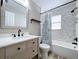Updated bathroom featuring a new vanity with granite countertop, and a tiled tub with shower at 9580 130Th Ave, Largo, FL 33773