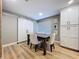 Dining area featuring hardwood floors, modern lighting, and a sliding barn door at 9580 130Th Ave, Largo, FL 33773