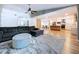 Open-concept living space with seamless flow between living room, dining area, and modern kitchen at 9580 130Th Ave, Largo, FL 33773