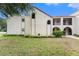 Charming condo featuring well-maintained landscaping, architectural details including arched entries and trim at 9700 Starkey Rd # 312, Seminole, FL 33777