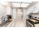 Bright kitchen with stainless steel appliances, butcher block counters and recessed lighting at 9700 Starkey Rd # 312, Seminole, FL 33777