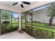Screened porch offers relaxing view with lush landscaping and protection from the elements at 9700 Starkey Rd # 312, Seminole, FL 33777