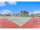 Community tennis courts with mature shade tree nearby at 9700 Starkey Rd # 312, Seminole, FL 33777