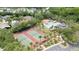 Aerial view of community amenities including tennis courts, pool, playground, and clubhouse at 9721 Fredericksburg Rd, Tampa, FL 33635