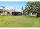 Spacious backyard with patio and lush green lawn, perfect for outdoor activities and relaxation at 9721 Fredericksburg Rd, Tampa, FL 33635