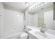 Clean bathroom featuring a single sink, shower/tub combo, and recessed lighting at 9721 Fredericksburg Rd, Tampa, FL 33635