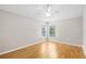 This empty bedroom includes wood floors and natural light at 9721 Fredericksburg Rd, Tampa, FL 33635