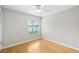Bedroom with wood floors, ceiling fan, and an abundance of natural light at 9721 Fredericksburg Rd, Tampa, FL 33635