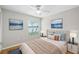 Bedroom features a calming atmosphere, ceiling fan, natural light, and serene lake view at 9721 Fredericksburg Rd, Tampa, FL 33635