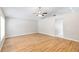 Bright living room with neutral walls, new flooring, and ceiling fan at 9721 Fredericksburg Rd, Tampa, FL 33635