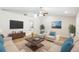 Bright living room with neutral walls, new flooring, ceiling fan, and modern decor at 9721 Fredericksburg Rd, Tampa, FL 33635
