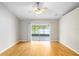 Main bedroom with hardwood floors and a sliding glass door offering lake view at 9721 Fredericksburg Rd, Tampa, FL 33635
