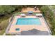 Beautiful community pool with lounge seating and adjacent playground area at 9721 Fredericksburg Rd, Tampa, FL 33635