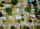 An aerial view of a neighborhood with a variety of homes, manicured lawns and mature trees at 1022 Greenbriar Dr, Brandon, FL 33511