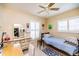 Relaxing bedroom with a single bed, vanity and neutral color palette at 1022 Greenbriar Dr, Brandon, FL 33511