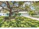 Charming single-story home features a bright exterior, manicured lawn, and an attached garage at 1022 Greenbriar Dr, Brandon, FL 33511