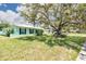 Charming single-story home features a bright exterior, manicured lawn, and an attached garage at 1022 Greenbriar Dr, Brandon, FL 33511