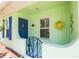 A charming front porch shows a bright exterior, a lovely wreath, and unique decor at 1022 Greenbriar Dr, Brandon, FL 33511