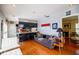 Inviting living area featuring sleek black kitchen and hardwood floors at 1022 Greenbriar Dr, Brandon, FL 33511