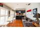 Bright living room featuring a sleek black kitchen island, and ample natural light at 1022 Greenbriar Dr, Brandon, FL 33511