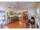 Bright living room with hardwood floors, a piano, and unique decorative elements at 1022 Greenbriar Dr, Brandon, FL 33511