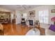 Inviting living room featuring hardwood floors, fireplace, and lots of natural light at 1022 Greenbriar Dr, Brandon, FL 33511