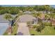 This is an aerial view of the property showing its nice landscaping and proximity to neighboring homes at 10801 Collar Dr, San Antonio, FL 33576